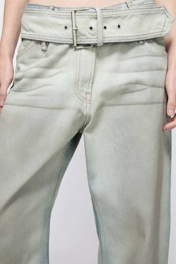 Acne Studios Coated denim trousers Im Verkauf