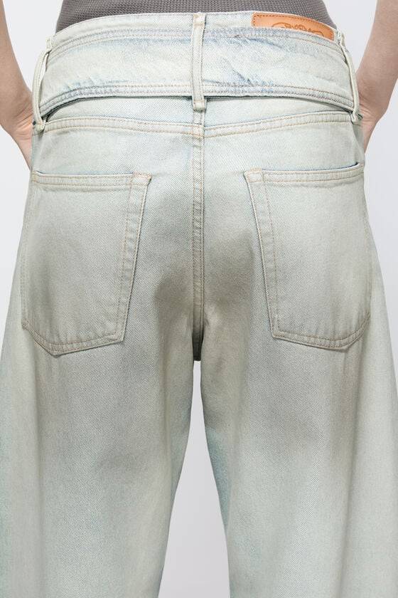 Acne Studios Coated denim trousers Im Verkauf